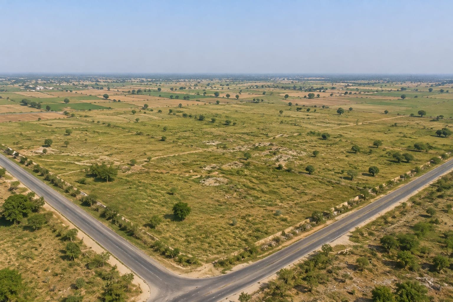 RZONE Land for Sale in Sector 10, Palwal | 46 Acres | 33 & 66 Ft Road Frontage | ₹10 Cr/Acre - Image 1